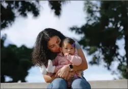  ?? DANIA MAXWELL/LOS ANGELES TIMES/TNS ?? Sofia Tavitian and her 7-month-old daughter Luna Tavitian-Monterrosa pose for a portrait at Brand Park on Wednesday, Jan. 11, 2023 in Glendale, California. Sofia is a Los Angeles Unified School District teacher who went on a leave of absence to take care of her young daughter because she wasn’t able to find affordable child care.