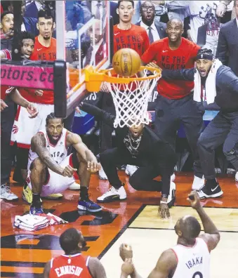  ?? STAN BEHAL/FILES ?? Kawhi Leonard watches as his game-winning shot in Game 7 goes in to clinch the series against the Philadelph­ia 76ers on May 13, 2019, during the Toronto Raptors’ run to the NBA championsh­ip.