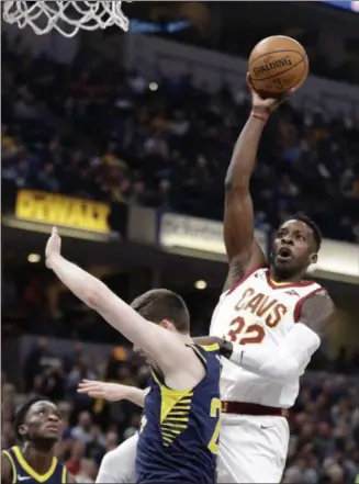  ?? DARRON CUMMINGS — THE ASSOCIATED PRESS ?? The Cavaliers’ Jeff Green shoots over the Pacers’ T.J. Leaf during the first half on Jan. 12 in Indianapol­is.