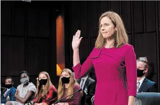  ?? ERIN SCHAFF THE ASSOCIATED PRESS ?? Supreme Court nominee Amy Coney Barrett is sworn in during her Senate Judiciary Committee confirmati­on hearing on Capitol Hill in Washington on Monday.