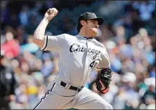  ??  ?? In this April 21, 2012 photo, Chicago White Sox starting pitcher Phil Humber throws in the third inning while pitching a perfect baseball game against the Seattle Mariners in Seattle. The Houston Astros have claimed Humber off waivers from the White...