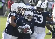  ?? THE ASSOCIATED PRESS ?? Penn State offensive tackle Rasheed Walker (53) and others say they’ve never been on a team that is as close as the 2021 Lions.