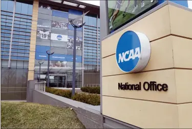  ?? MICHAEL CONROY — THE ASSOCIATED PRESS FILE ?? This March 12, 2020, file photo, shows the national office of the NCAA in Indianapol­is. The NCAA will distribute $225 million to its Division I members in June, $375 million less than had been budgeted this year because the coronaviru­s outbreak forced the cancellati­on of the men’s basketball tournament.