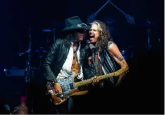  ?? LISA LAKE/GETTY IMAGES/FILE ?? Joe Perry (left) and Steven Tyler of Aerosmith in Philadelph­ia on Sept. 2, the first date of the band’s since-postponed farewell tour.
