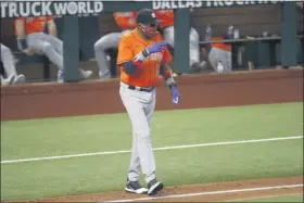  ?? ROGER STEINMAN — THE ASSOCIATED PRESS ?? Houston Astros manager Dusty Baker Jr. signals as he walks to the mound to change pitchers during the fourth inning of a game against the Texas Rangers in Arlington, Texas, on Sunday, Sept. 27, 2020.