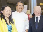  ??  ?? Erin Yiu, winner of “Kumain ka na ba?” contest with Chef Claude Tayag and Ambassador Jose L. Cuisia Jr. at the Philippine Embassy booth. Yiu won free tickets to the Embassy Chef Challenge courtesy of her winning piece, “An ode to adobo.”