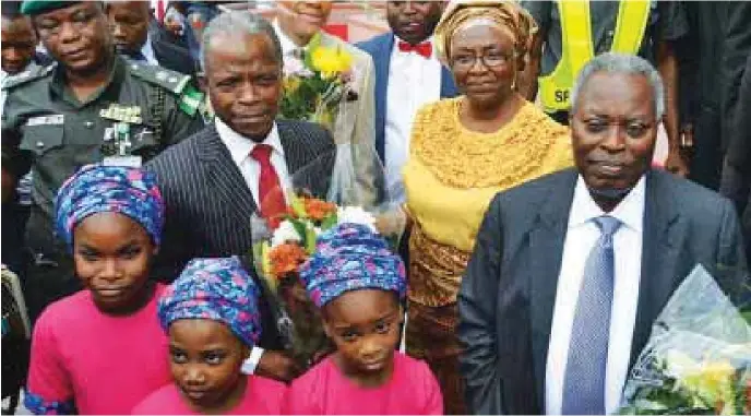  ??  ?? R-L: Pastor William Kumuyi, his wife, Mrs. Esther Kumuyi and Vice-President Yemi Osinbajo with children during the inaugurati­on of the Deeper Life Bible Church New Auditorium, Gbagada…recently