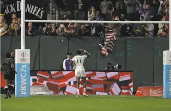  ?? Jeff Chiu / Associated Press ?? Team USA’s Perry Baker celebrates after one of his two scoring tries against Wales on Friday at AT&T Park. The fifth-seeded Americans are counting on a boost from their home crowd.