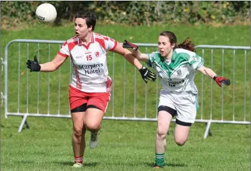  ??  ?? Tinahely’s Loretta Gilbert battles for possession with Moorefield’s Shauna Doyle.
