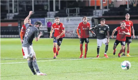  ?? REUTERS ?? Manchester United’s Juan Mata scores their first goal from the penalty spot against Luton in the League Cup third round.