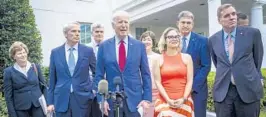  ?? PETE MAROVICH/THE NEW YORK TIMES ?? President Joe Biden speaks with a bipartisan group of senators after an infrastruc­ture package meeting last week at the White House. The bipartisan deal has been a key priority for Biden.