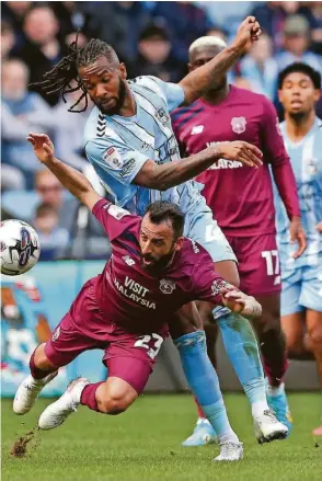  ?? ?? City’s Kasey Palmer and Cardiff’s Manolis Siopis (left) battle for the ball