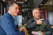  ?? GENE SWEENEY JR. / GETTY IMAGES ?? Mitt Romney greets customers at J Dawgs restaurant in Provo, Utah, Saturday. Romney is seeking Orrin Hatch’s seat in the U.S. Senate.