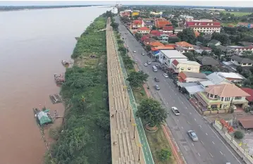  ??  ?? An aerial view of Muang Nakhon Phanom on the Mekong River. The area will get a new border freight centre.