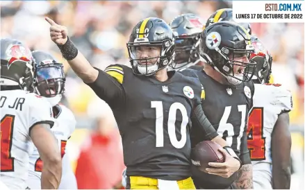  ?? ?? Mitch Trubisky (10) celebra una anotación en el último cuarto.