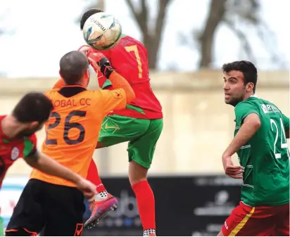  ??  ?? Gharghur goalkeeper Ryan Micallef punches the ball to safety ahead of the arrival of Keith Tanti of Senglea Athletic Photo: Domenic Aquilina