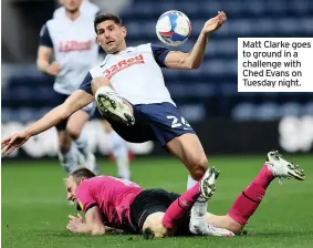  ??  ?? Matt Clarke goes to ground in a challenge with Ched Evans on Tuesday night.