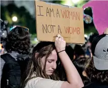  ?? ?? Abortion-rights advocates demonstrat­e outside of the Supreme Court Building in Washington, DC. (AFP)