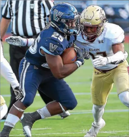  ?? PETE BANNAN — DIGITAL FIRST MEDIA ?? Villanova’s junior running back Aaron Forbes, seen here grounding it out earlier gained 140 yards on 13 carries Saturday as the Wildcats stomped Delaware. this season against Elon,