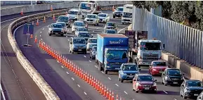  ?? RYAN ANDERSON/STUFF ?? Traffic builds up yesterday morning due to lane closures after two trucks rolled and damaged the bridge on Friday.