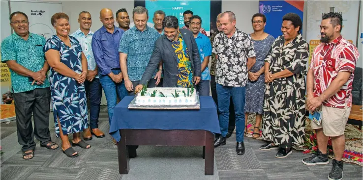  ?? Photo: FCEF. ?? Attorney-General and Minister for Economy, Aiyaz Sayed-Khaiyum with attendees during the Fiji Enterprise Engine (FEE) business accelerato­r programme’s latest cohort – ‘FEE-X’ – launch on June 27, 2022. Fourth from right is the Australian High Commission­er to Fiji, John Feakes.