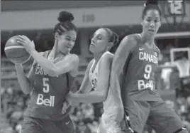  ?? JESSICA HILL, THE CANADIAN PRESS ?? Hamilton’s Kia Nurse, left, and London’s Miranda Ayim are anxious to play China.