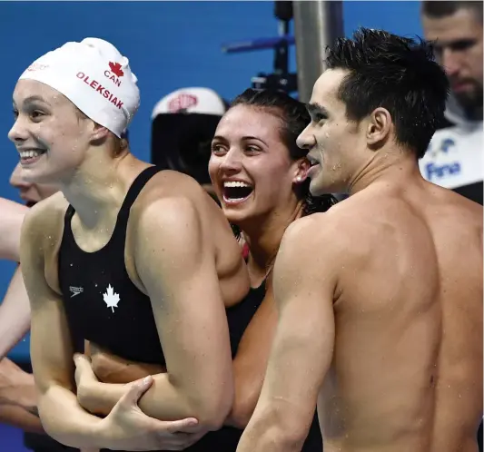  ??  ?? L’équipe canadienne a remporté la médaille de bronze du relais mixte 4x100 m libre hier aux Championna­ts du monde. PHOTO AFP