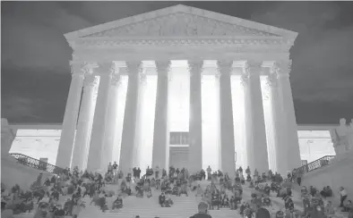  ?? TASOS KATOPODIS/GETTY 2020 ?? People mourn the death of Supreme Court Justice Ruth Bader Ginsburg in front of the Supreme Court.