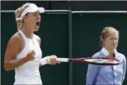  ?? KIRSTY WIGGLESWOR­TH —ASSOCIATED PRESS ?? Germany’s Angelique Kerber celebrates after winning a point against Shelby Rogers of the United States during their singles match at the Wimbledon Championsh­ips in London on July 8.