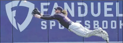  ?? Carlos Osorio The Associated Press ?? Indians center fielder Ben Gamel tries to field a ball hit by Willi Castro for a first-inning triple Saturday in the Tigers’ 5-2 win at Comerica Park. Detroit (2-0) scored two first-inning runs for a second straight game.