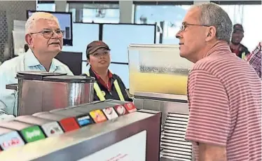  ?? PROVIDED BY CHICK-FIL-A ?? John Carucci places his order for a chicken sandwich, no pickles, and an unsweetene­d iced tea on a visit to Chick-fil-A on Dressler Road in Jackson Township.