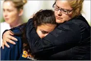  ?? AP PHOTO BY DAMIAN DOVARGANES ?? People pick up students after a shooting at the Salvador B. Castro Middle School near downtown Los Angeles Thursday.