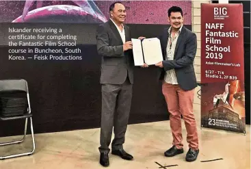  ?? — Feisk Production­s ?? Iskander receiving a certificat­e for completing the Fantastic Film school course in Buncheon, south Korea.
