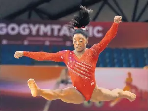  ?? VADIM GHIRDA/ASSOCIATED PRESS ?? Simone Biles of the United States performs on the floor during the women’s team final of the Gymnastics World Championsh­ips in Qatar on Tuesday.