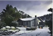  ??  ?? The cosy Writer’s House — near Cygnet, Tasmania — is sometimes dusted with snow in winter.