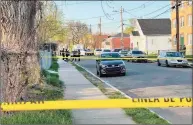  ?? Nicholas Rondinone / Hearst Connecticu­t Media ?? Hartford police officers and detectives gathered at the scene of a shooting on Magnolia Street Saturday. Jamari Preston, 16, of New Britain was killed in the shooting.