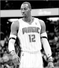  ?? — Photo by The Associated Press ?? The Los Angeles Lakers have a deal in place to acquire Dwight Howard from Orlando in a four-team, 12-player trade also involving the Denver Nuggets and the Philadelph­ia 76ers. As part of the deal the Lakers’ Andrew Bynum joins Philly, who lose Andre...