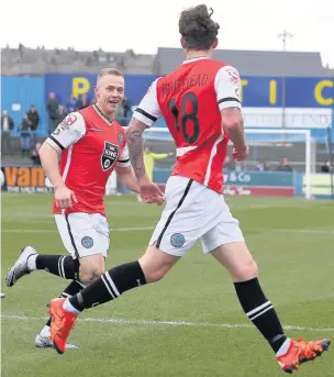  ?? Peter Hilton Photograph­y ?? ●● Danny Whitehead celebrates with Danny Rowe after firing Macclesfie­ld ahead against Barrow at the weekend