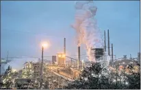  ?? MARTIN MEISSNER — THE ASSOCIATED PRESS FILE ?? A ThyssenKru­pp coking plant steams around the clock for the nearby steel mill in Duisburg, Germany, in January 2020. The cuts in greenhouse gas emissions pledged by government­s around the world aren’t enough to achieve the headline goal of the Paris climate accord, according to a United Nations report published Friday.