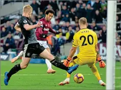  ??  ?? AT THE DOUBLE: Anderson scores his second goal after 84 minutes, slotting the ball through goalkeeper Joe Hart’s legs