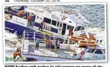 ??  ?? NYPD harbor unit rushes to aid woman on verge of giving birth on charter boat off Riis Park in Queens.