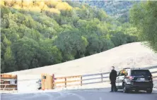  ?? Santiago Mejia / The Chronicle ?? Police block a road leading to Pleasanton Ridge, where authoritie­s believe the body of Philip Kreycik was found.