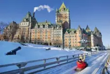  ?? DREAMSTIME ?? You’ll want the slide with a view, in front of Fairmont Le Château Frontenac.