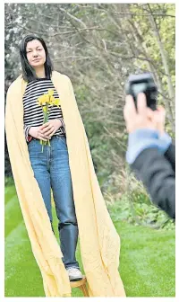  ?? — AFP photos ?? Vlada takes pictures of Yulia while she poses in her garden, in Blackheath, south London as part of a photo series called ‘Nezlamna’, wich translates as ‘Unbreakabl­e’ portraying Ukrainian female refugees who came to England during the war in Ukraine.