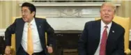  ?? AFP/GETTY IMAGES ?? Prime Minister Justin Trudeau eyes the extended hand of U.S. President Donald Trump on Monday. Above, Japan PM Shinzo Abe’s eye-rolling moment.