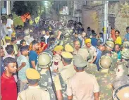  ?? PTI ?? Police at the scene of crime after the murder of a tailor by two men, allegedly over his social media posts, in Udaipur.