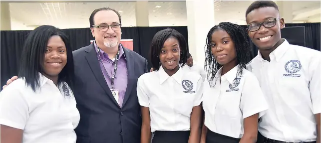  ??  ?? Andrew Fazio (second left), third vice-president of the BPIAJ and C&W Business executive, shares lens time with students from the Portmore Community College’s Computer Studies Department (from left) Marcella Gayle, Tamesha Senior, Shanice James and...