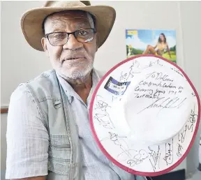  ?? IAN ALLEN/PHOTOGRAPH­ER ?? LEFT: Headley George ‘Dellmar’ Samuels displays his West Indies cricket hat that was autographe­d by members of the West Indies cricket team to mark the coverage of his 175th Test cricket match, during the recent series against England.