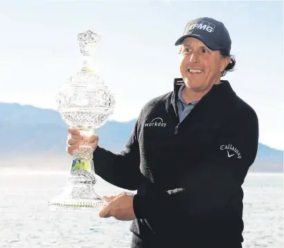  ?? HARRY HOW/GETTY IMAGES ?? Phil Mickelson celebrates his victory at the AT&amp;T Pebble Beach Pro-Am