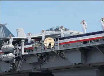  ?? Rob Ostermaier TNS ?? THE AIRCRAFT carrier Gerald R. Ford, commission­ed last summer, lacks a traditiona­l steam catapult.